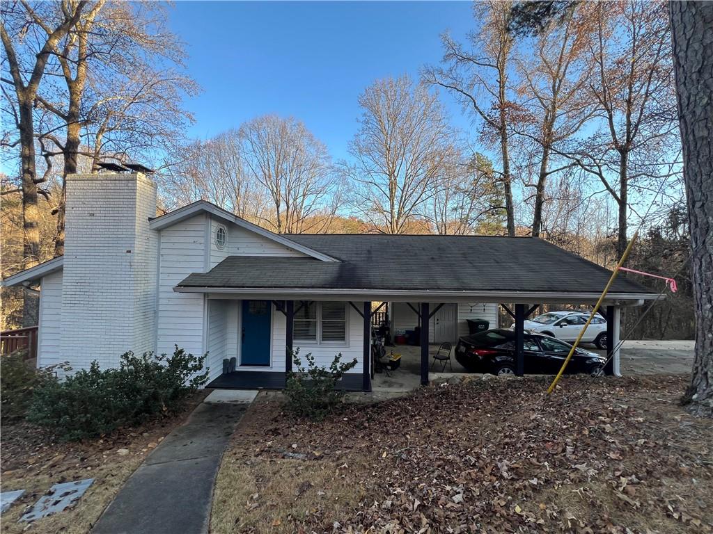 40 Chestatee Springs Road Dahlonega, GA 30533 - Photo 39 of 42 a front view of a house with garden