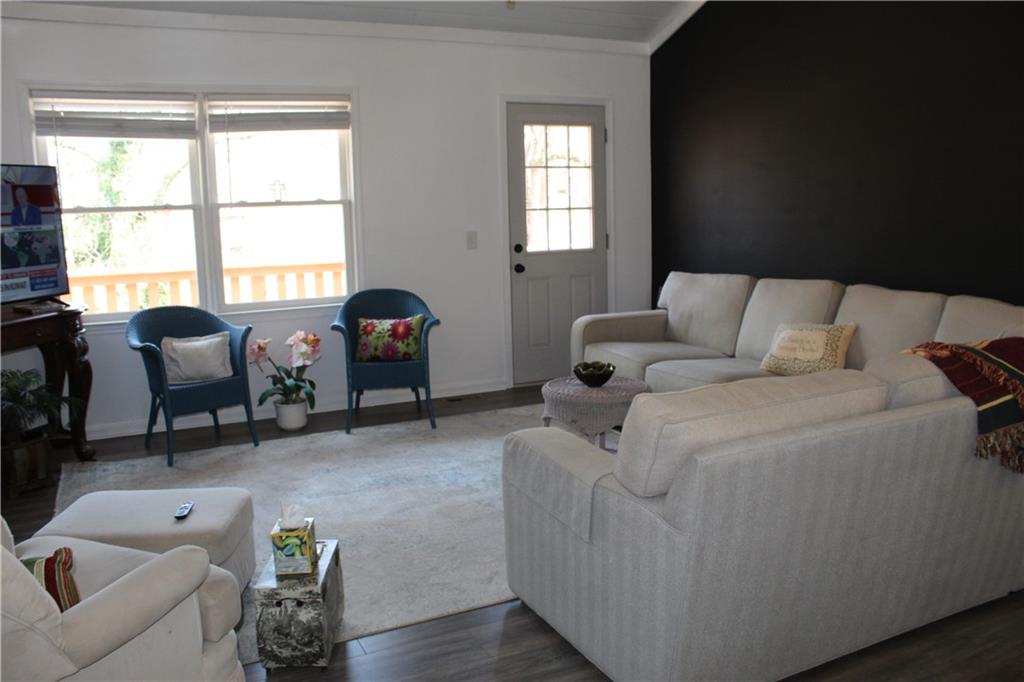 40 Chestatee Springs Road Dahlonega, GA 30533 - Photo 6 of 43 a living room with furniture and a window