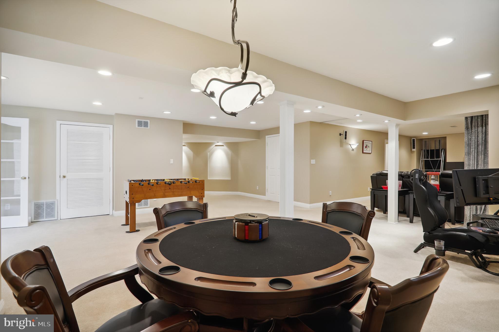 12101 Sheets Farm Road North Potomac, MD 20878 - Photo 65 of 105 Lower level poker table and gaming area