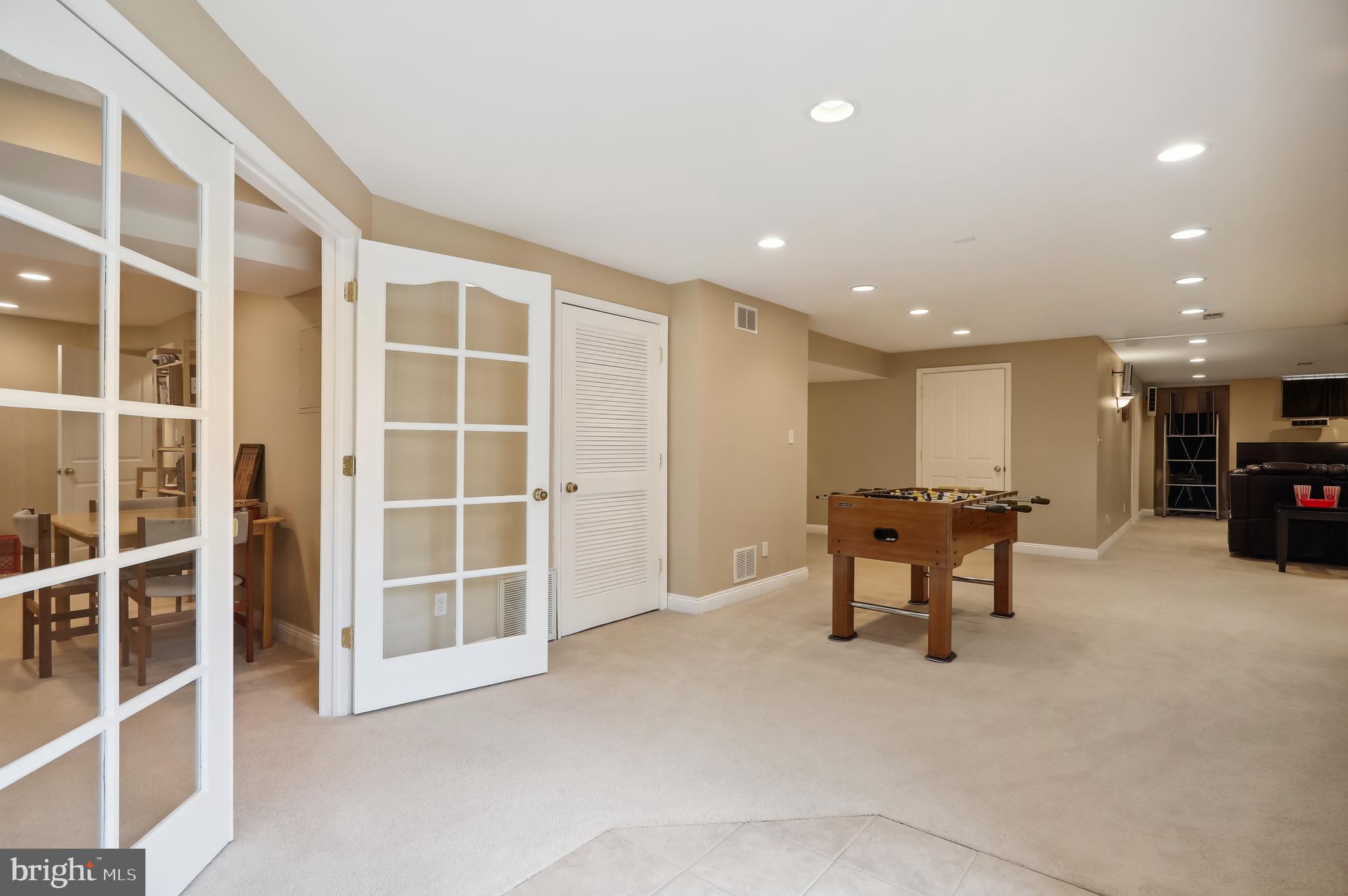 12101 Sheets Farm Road North Potomac, MD 20878 - Photo 71 of 105 Lower level playroom leading to game area