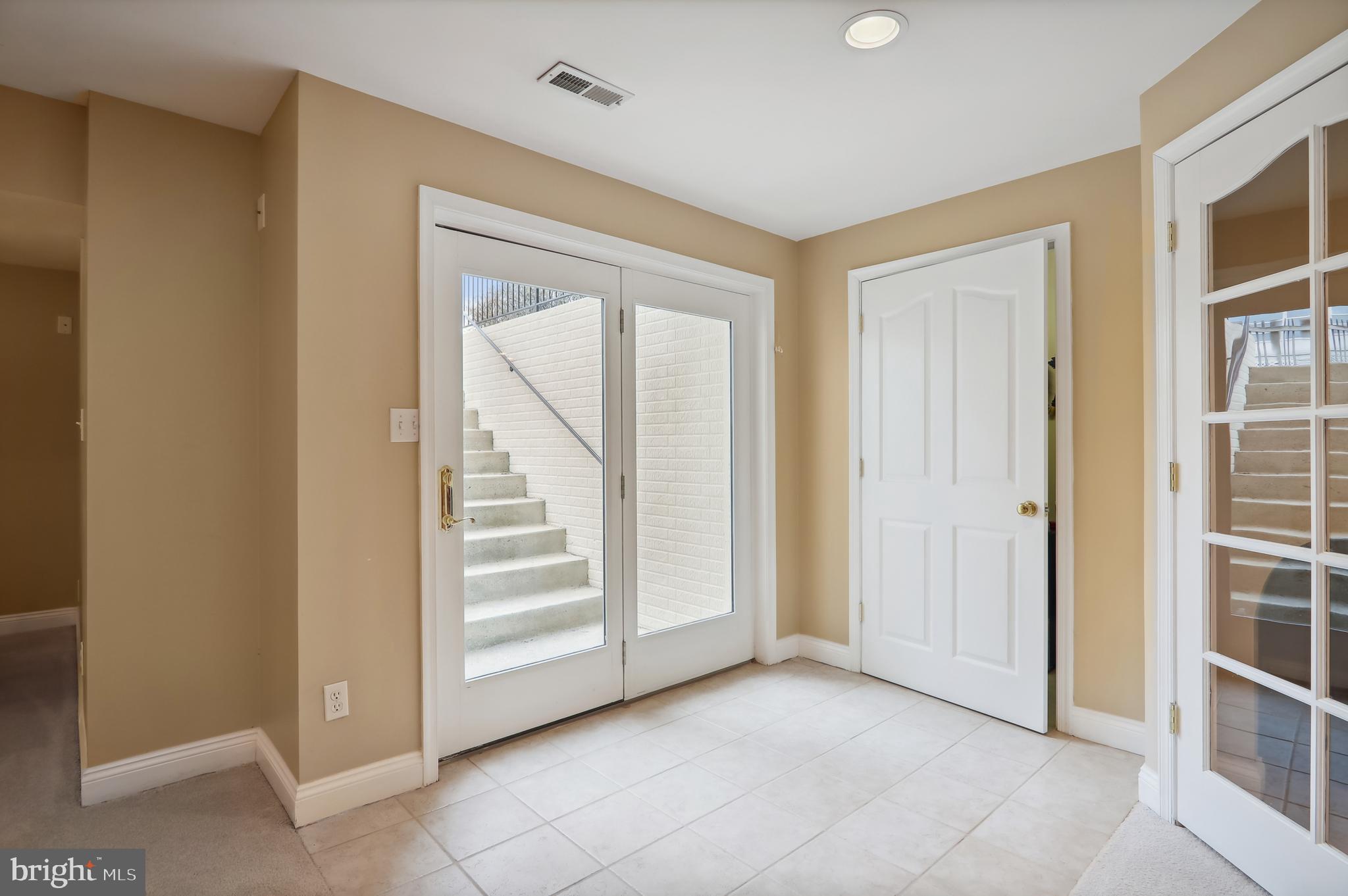 12101 Sheets Farm Road North Potomac, MD 20878 - Photo 73 of 105 Lower level staircase leading out to backyard