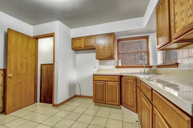 a kitchen with stainless steel appliances granite countertop a sink and a cabinets