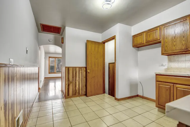 a view of hallway with cabinets