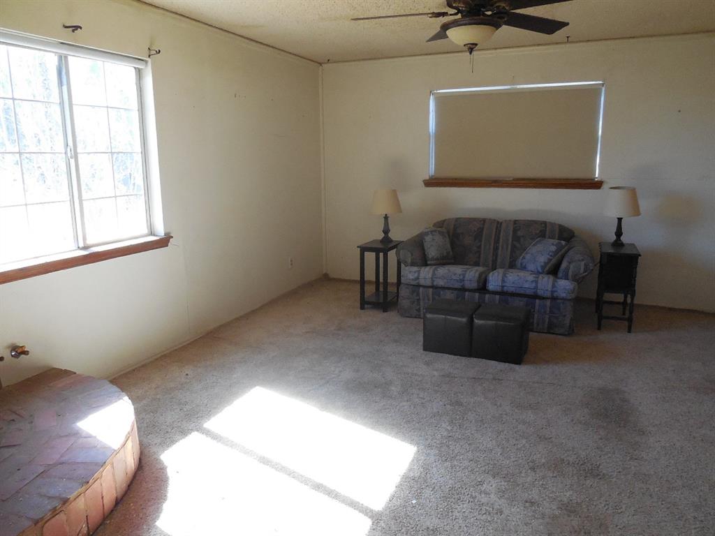 6008 Interstate 20 Ranger, TX 76470 - Photo 12 of 15 a living room with furniture and a window