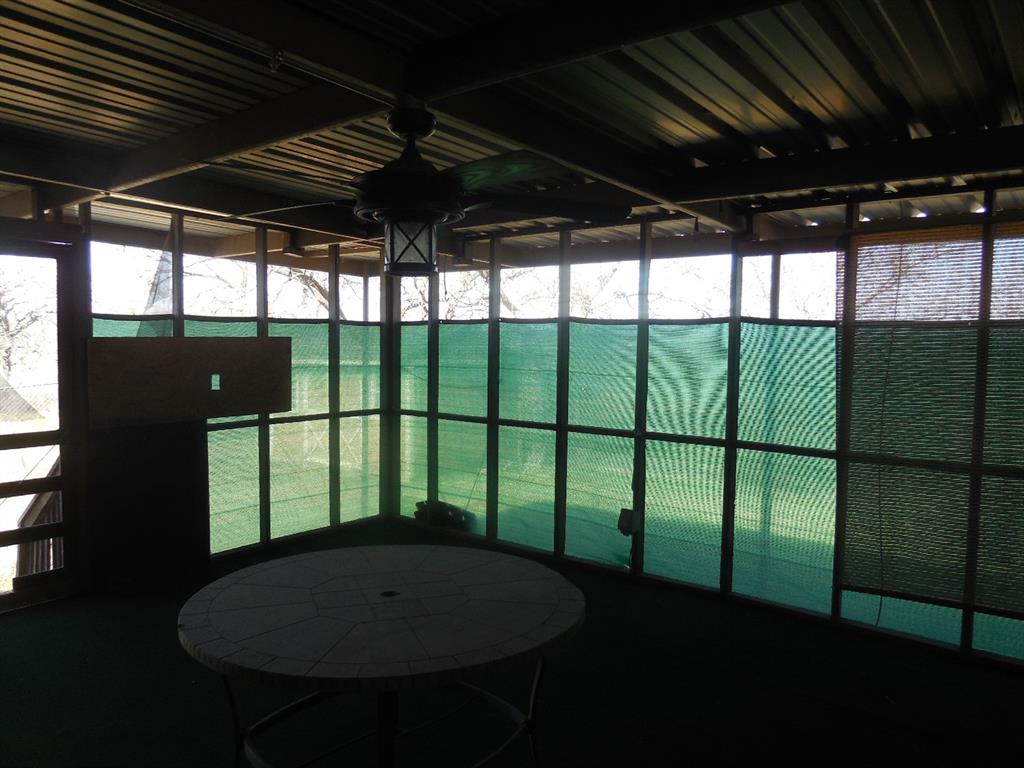 6008 Interstate 20 Ranger, TX 76470 - Photo 13 of 15 a roof deck with table and chairs