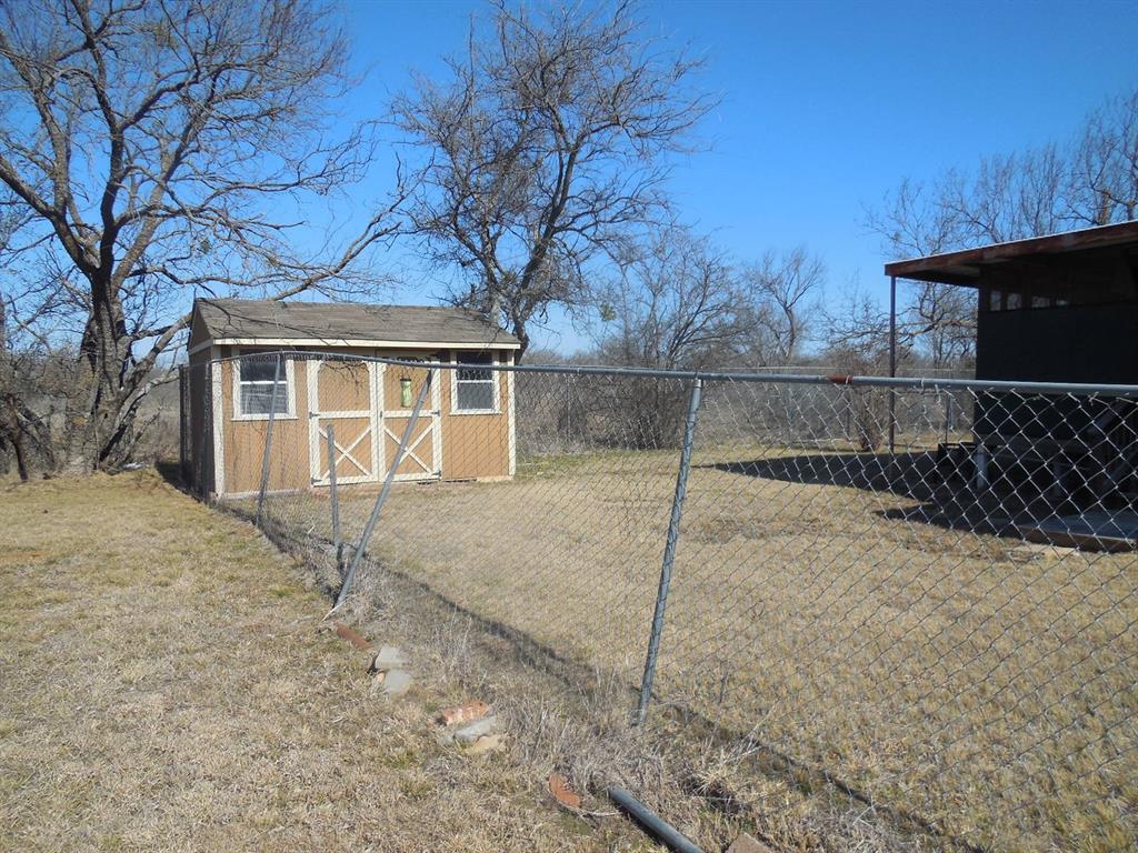 6008 Interstate 20 Ranger, TX 76470 - Photo 14 of 15 a house with trees in the background