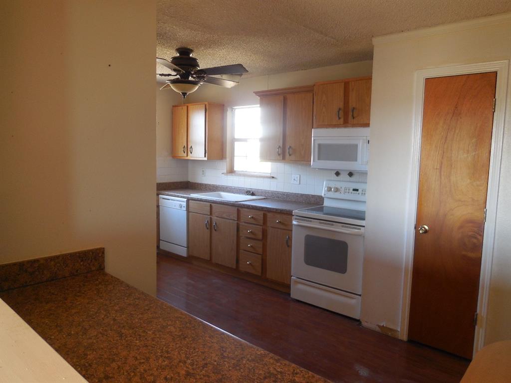 6008 Interstate 20 Ranger, TX 76470 - Photo 4 of 15 a kitchen with a sink and a stove top oven