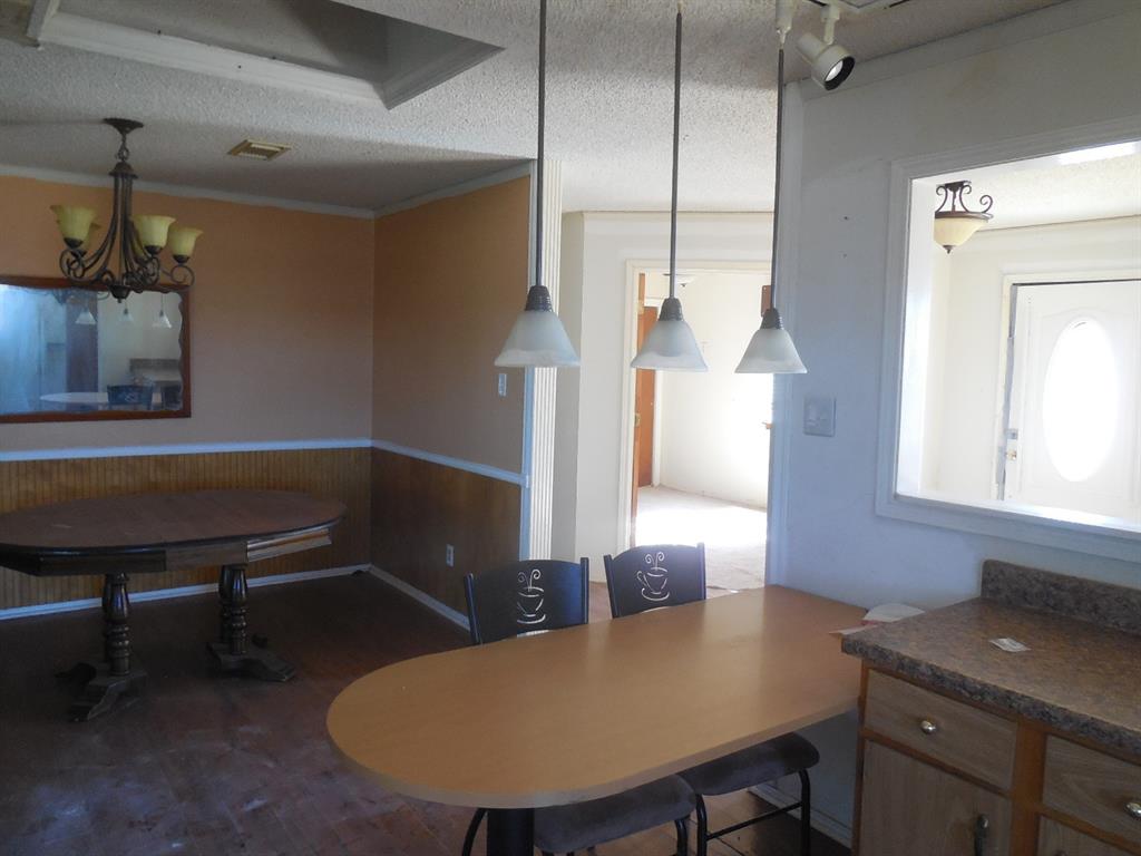 6008 Interstate 20 Ranger, TX 76470 - Photo 5 of 15 a bathroom with a sink a toilet and mirror