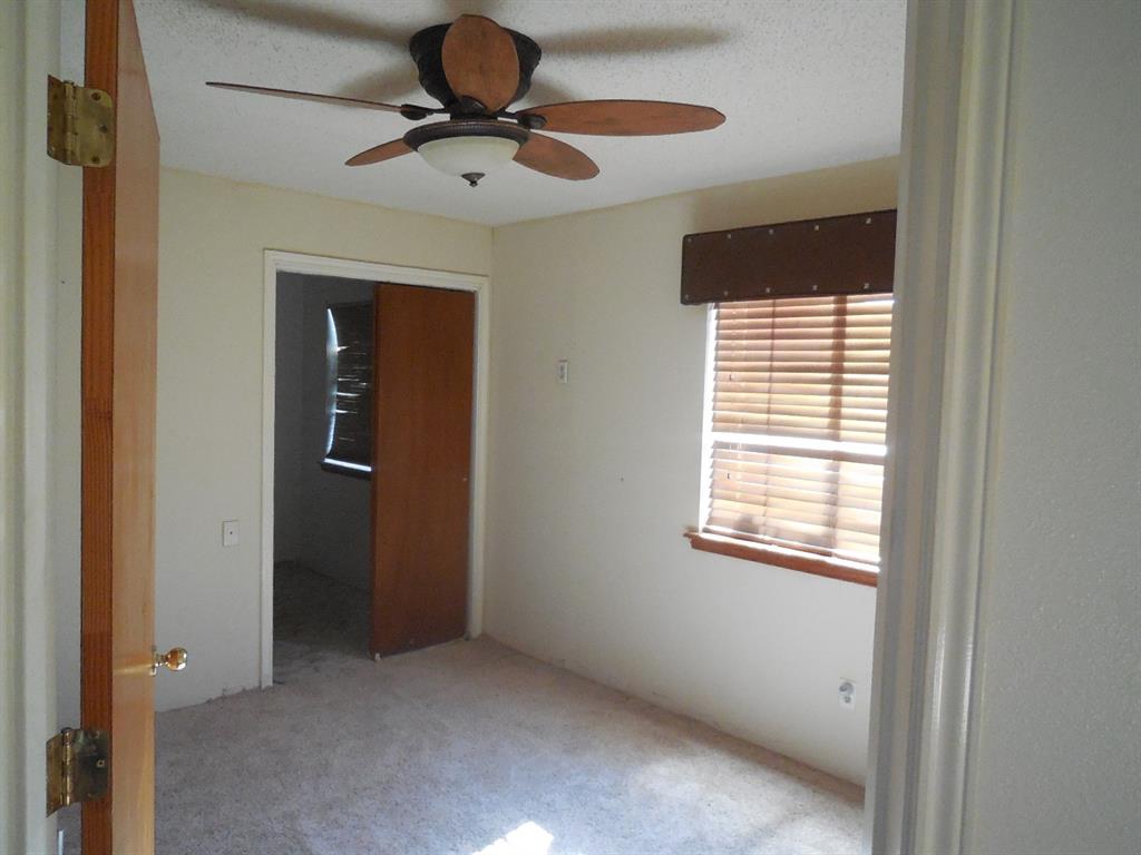 6008 Interstate 20 Ranger, TX 76470 - Photo 6 of 15 a view of an empty room with a window