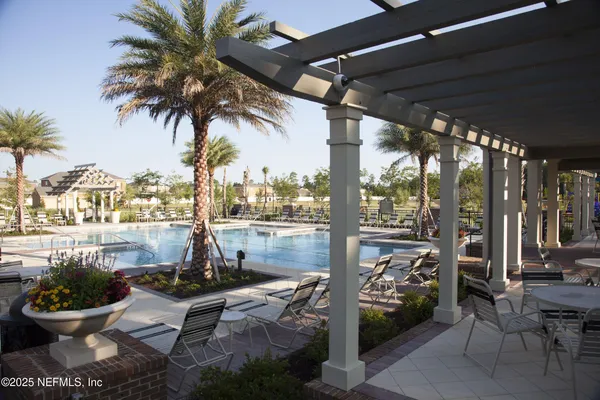 a view of a porch with furniture and a potted plants