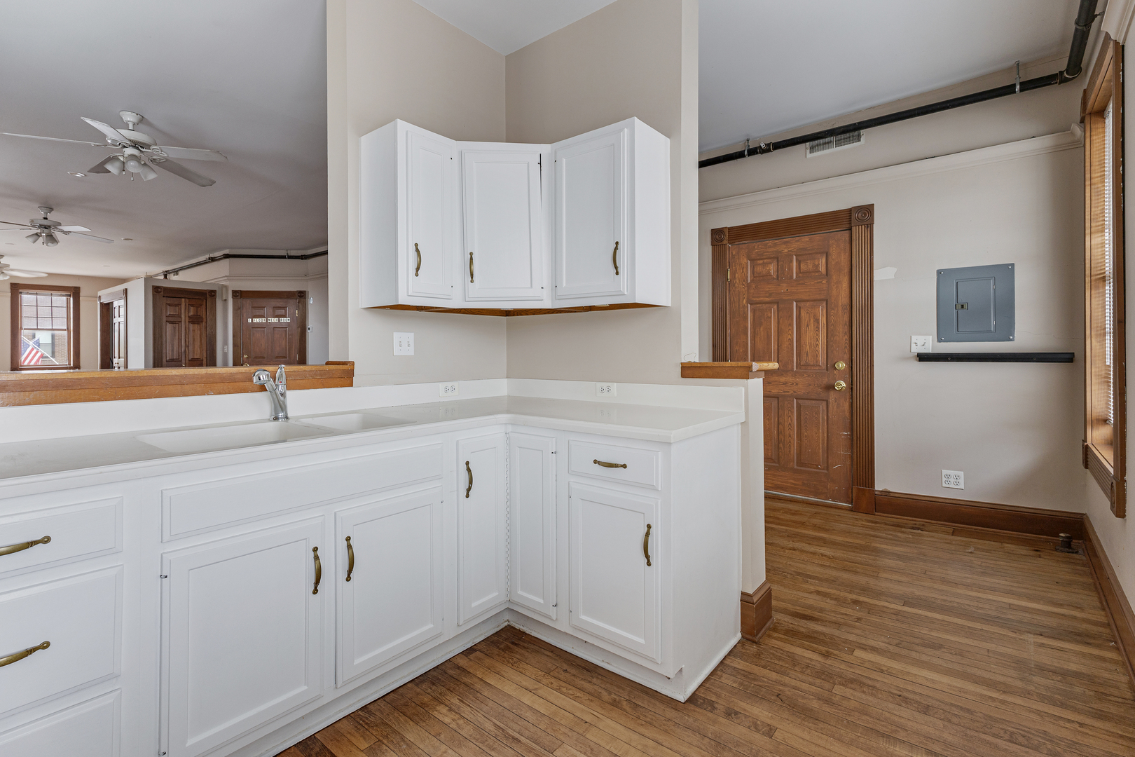 222 West Main Street, Unit A St. Charles, IL 60174 - Photo 8 of 17 a kitchen with cabinets and wooden floor
