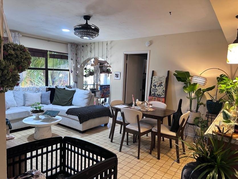 2480 West 67th Place, Unit 2312 Hialeah, FL 33016 - Photo 11 of 16 a view of a livingroom with furniture and a floor to ceiling window