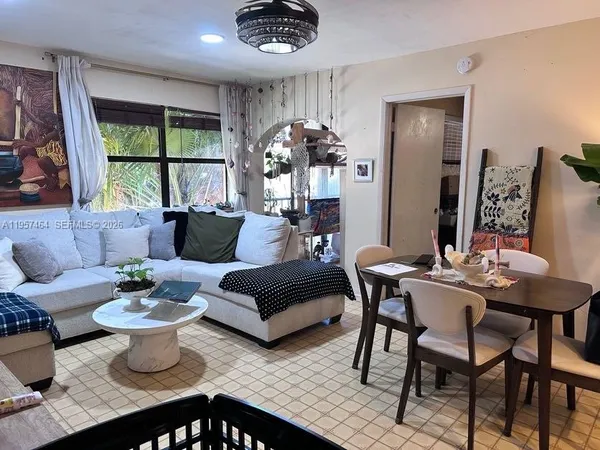 a living room with furniture and a large window