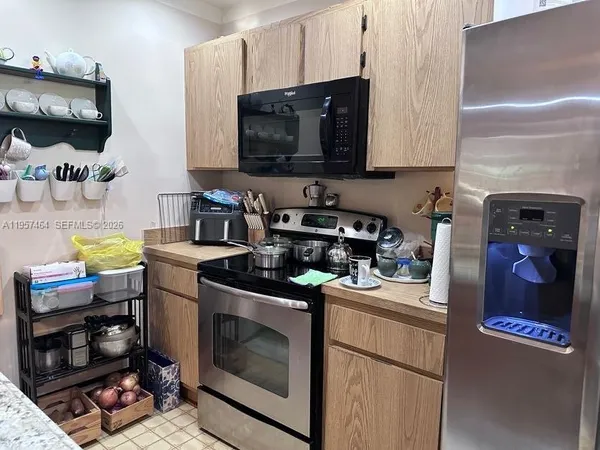 a kitchen with a stove and a microwave