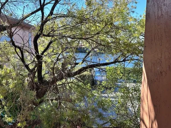 an aerial view of houses with yard