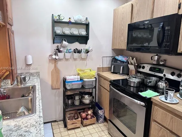 a kitchen with a stove and a microwave