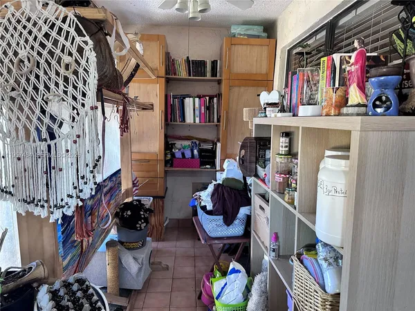 a room with furniture and a book shelf