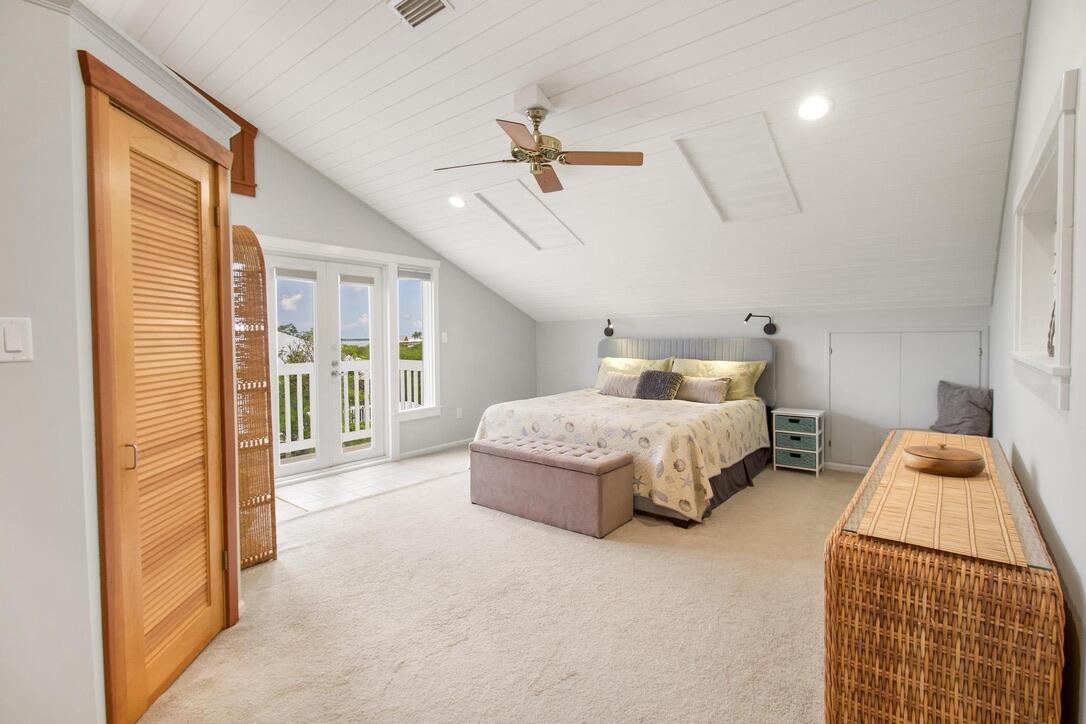 25057 7th Street Summerland Key, FL 33042 - Photo 11 of 43 a bedroom with a bed and a walk in closet