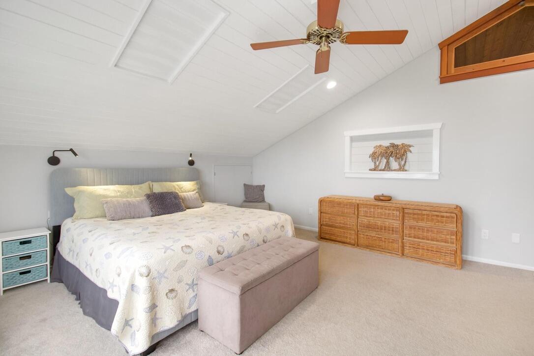 25057 7th Street Summerland Key, FL 33042 - Photo 12 of 43 a bedroom with a bed chandelier and dresser