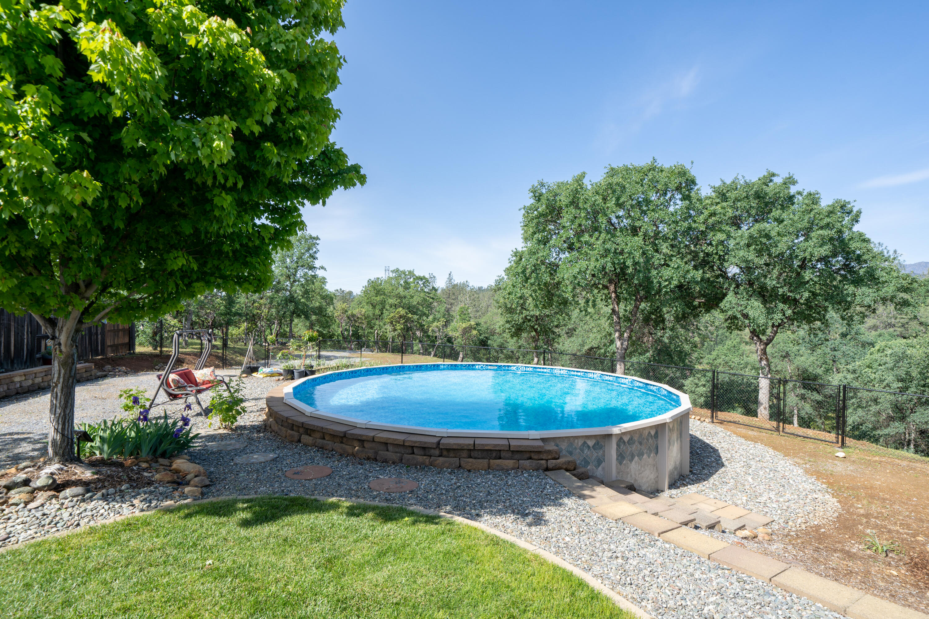 16671 Power Line Road Redding, CA 96001 - Photo 44 of 105 Pool has perimeter underwater bench