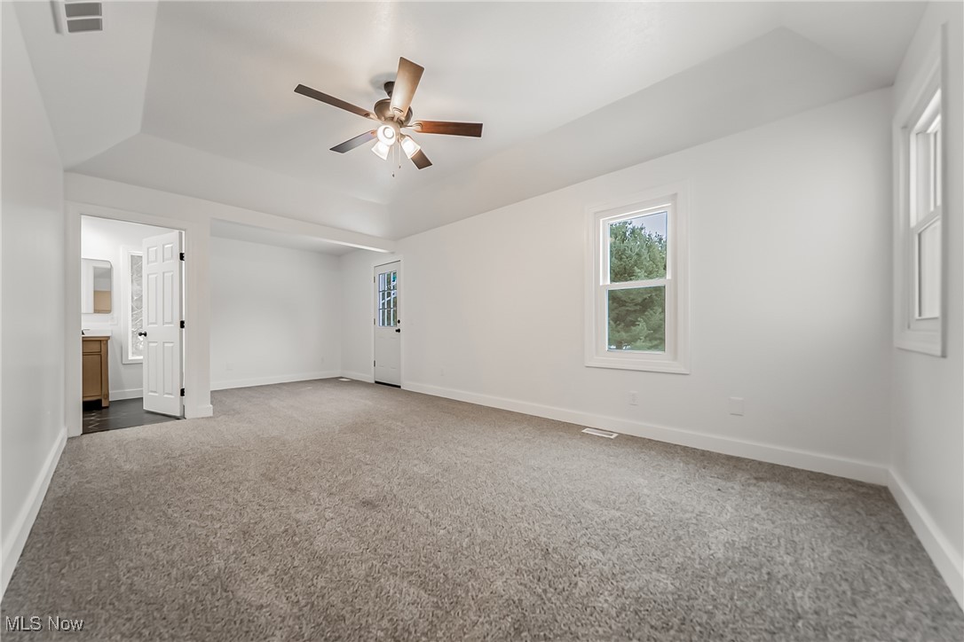 7488 Greenwich Road Seville, OH 44273 - Photo 18 of 37 Empty room featuring dark carpet and ceiling fan