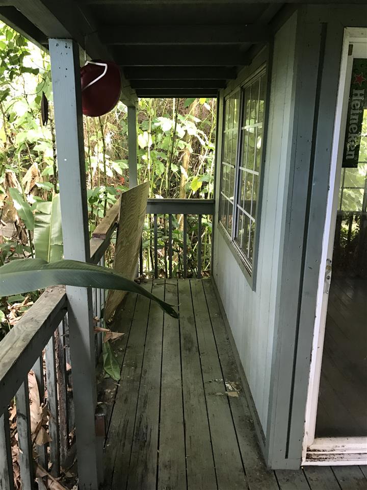 1075 Kokomo Road Haiku, HI 96708 - Photo 11 of 18 a view of balcony with wooden floor