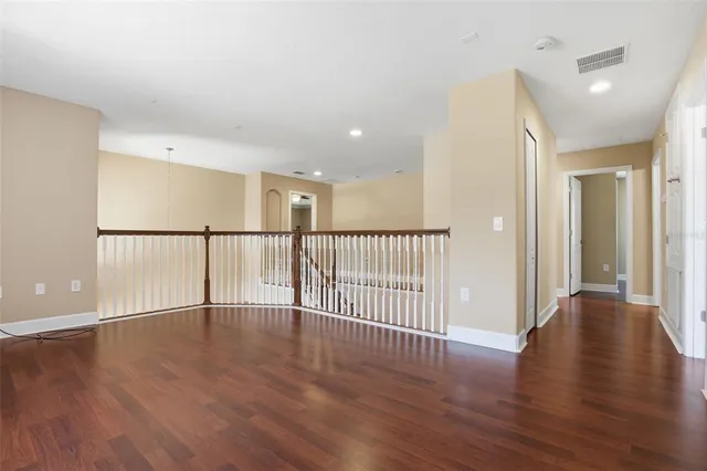 a view of an entryway with wooden floor