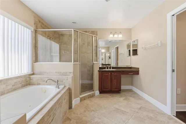 a bathroom with a bathtub and a sink
