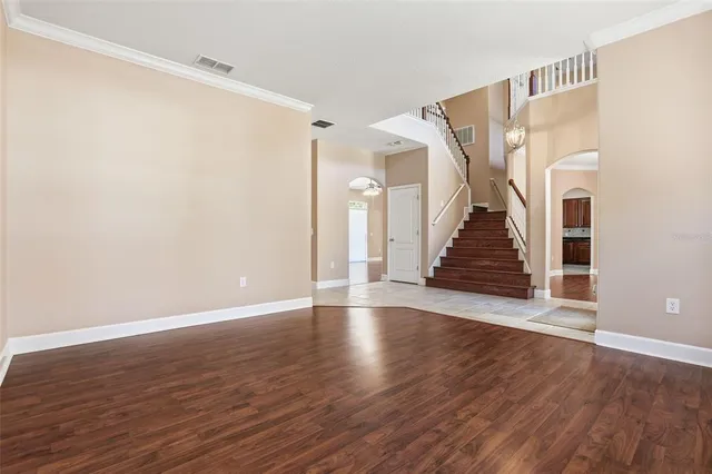 a view of an entryway with wooden floor