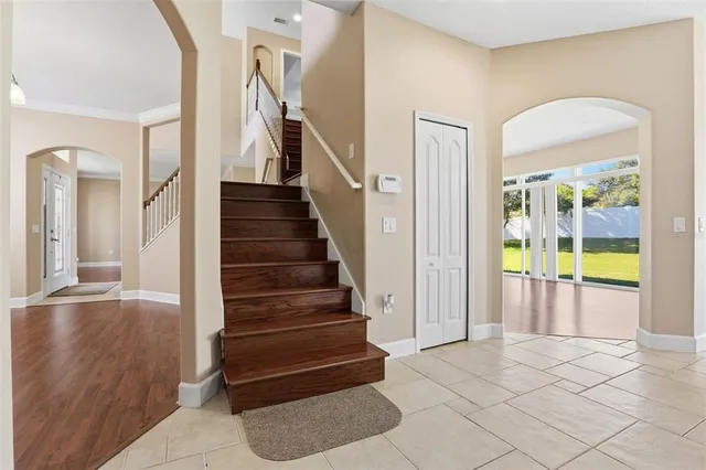a view of entryway and hall with wooden floor