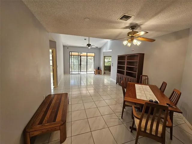 a view of a livingroom with an empty space and a window