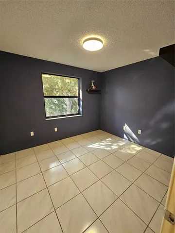 a view of a livingroom with wooden floor and furniture