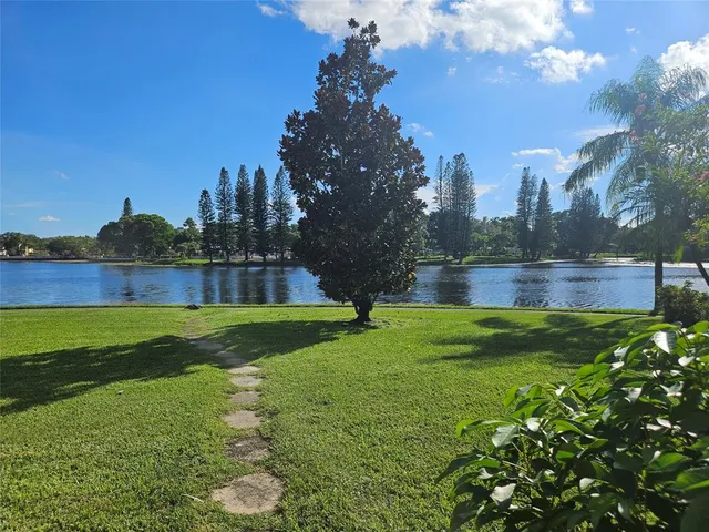 a view of a golf course with a lake view