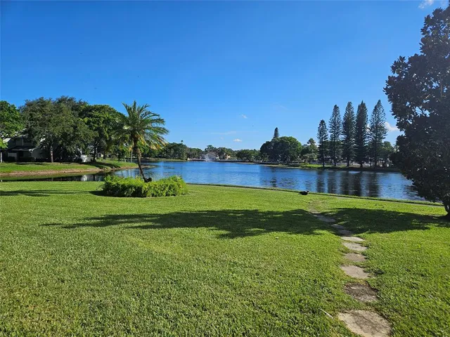 a view of a lake and a yard