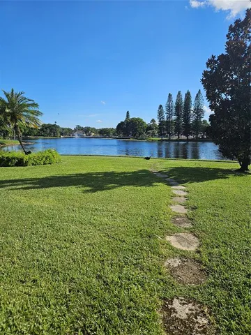 a view of a golf course with a lake