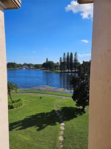 a view of a chair and tables in the backyard