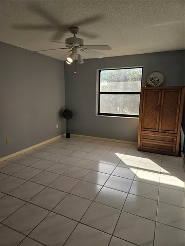 a view of a livingroom with wooden floor and a window