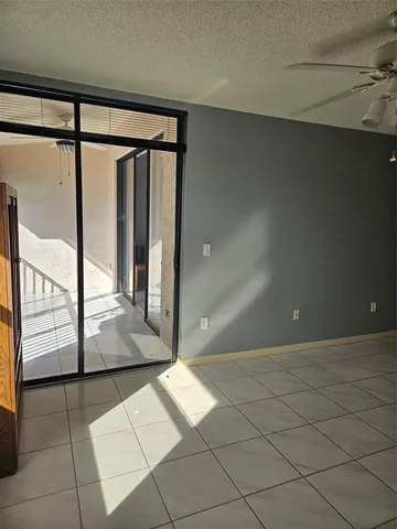 a view of a room with furniture and wooden floor