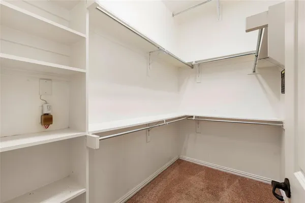 a view of an empty walk in closet