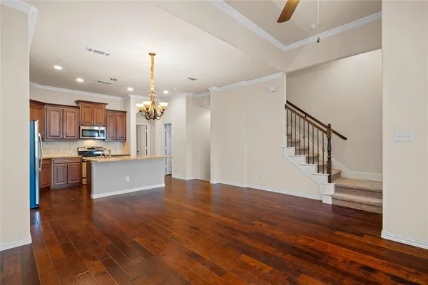 a view of kitchen with cabinets and wooden floor