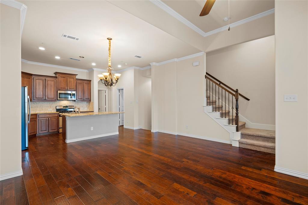 6465 Naples Drive Irving, TX 75039 - Photo 6 of 25 a view of kitchen with cabinets and wooden floor