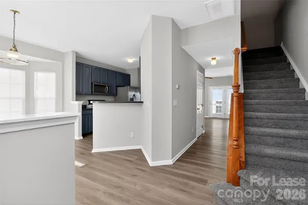 a view of a kitchen from the hallway