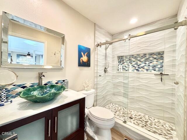 3721 Sunset Lane Oxnard, CA 93035 - Photo 12 of 26 a bathroom with a sink a toilet and shower