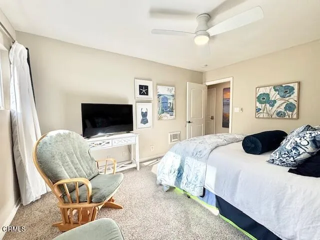 a bedroom with a bed and couch