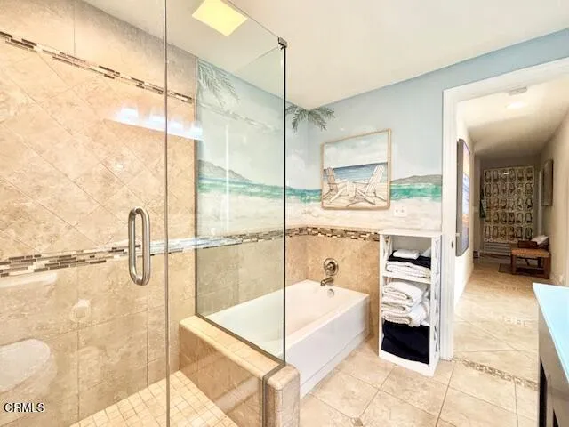 a bathroom with a tub and shower