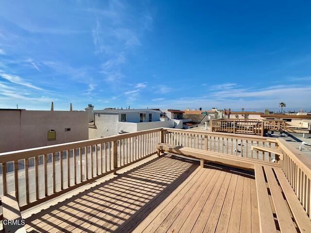 3721 Sunset Lane Oxnard, CA 93035 - Photo 8 of 26 a view of balcony with wooden floor and city view