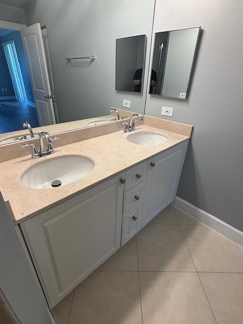 2401 Renaissance Way Boynton Beach, FL 33426 - Photo 11 of 21 a bathroom with a double vanity sink and mirror