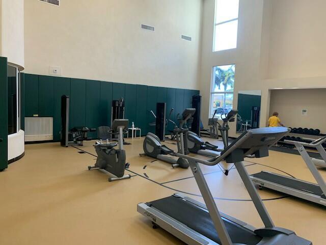 2401 Renaissance Way Boynton Beach, FL 33426 - Photo 4 of 21 a room with gym equipment and a large window