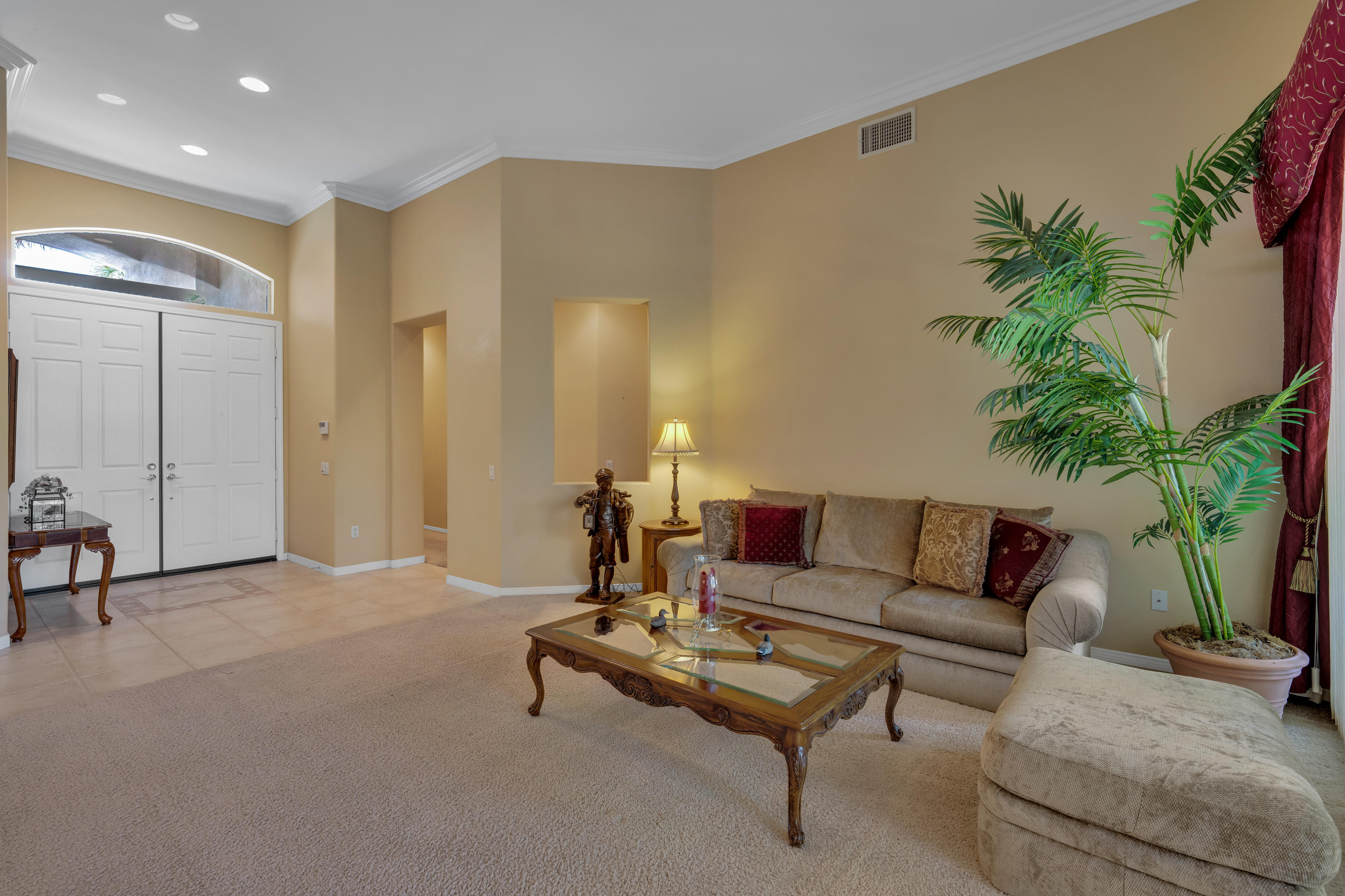 37384 Wyndham Road Palm Desert, CA 92211 - Photo 11 of 30 a living room with furniture and a potted plant