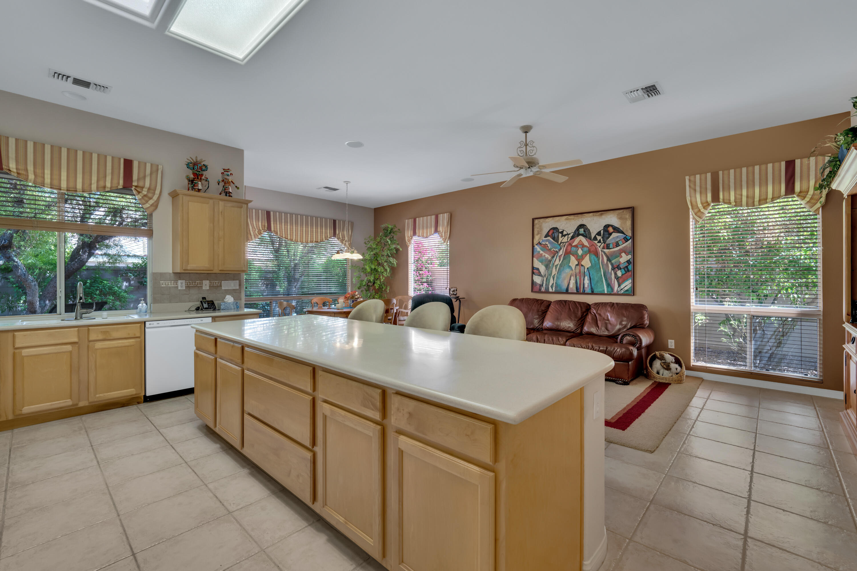 37384 Wyndham Road Palm Desert, CA 92211 - Photo 12 of 30 a large white kitchen with a large window
